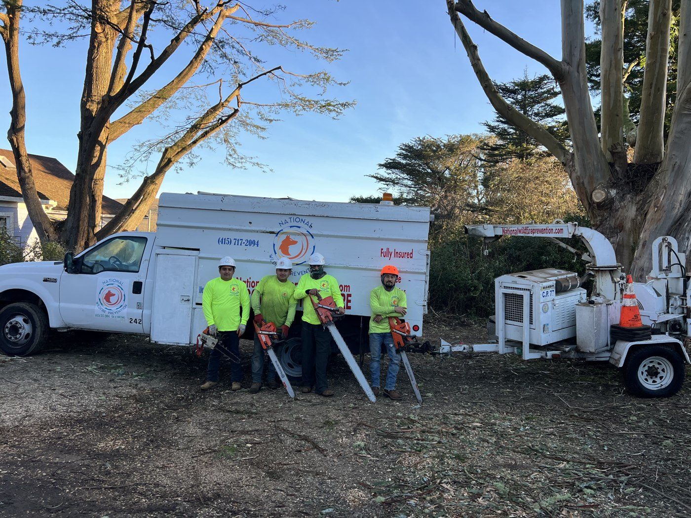 The NWP crew with the truck and chipper on a job site
